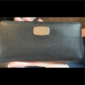 Black and silver wallet with a wristlet